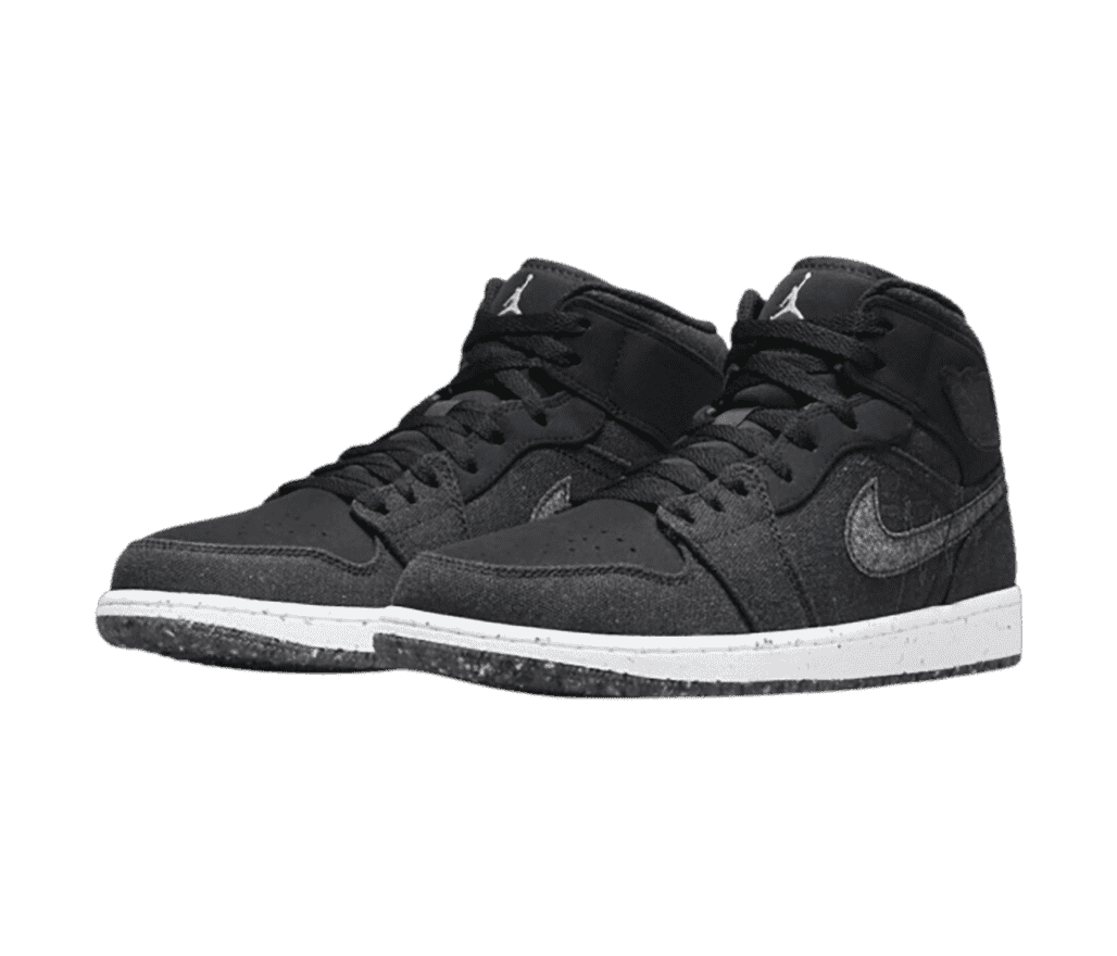 A pair of AJ1 Mid “Crater” sneakers in charcoal fabric uppers with lighter gray Swooshes and speckled soles.