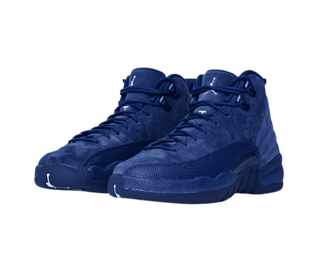 An indigo suede pair of AJ12 sneakers with snakeskin leather mudgaurds.