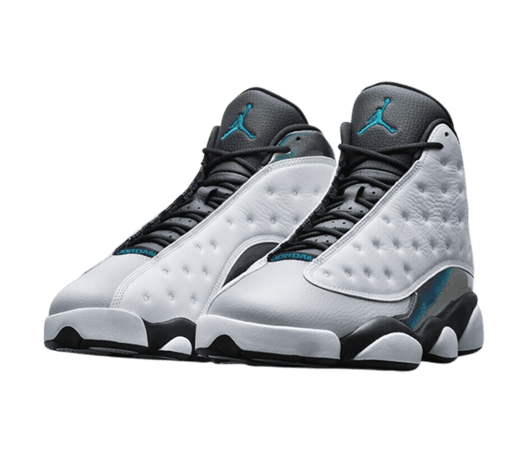 A pair of AJ13 “Wolf Grey” sneakers with white vamps, light gray toeboxes, hologram quarters, and teal Jumpman logos.
