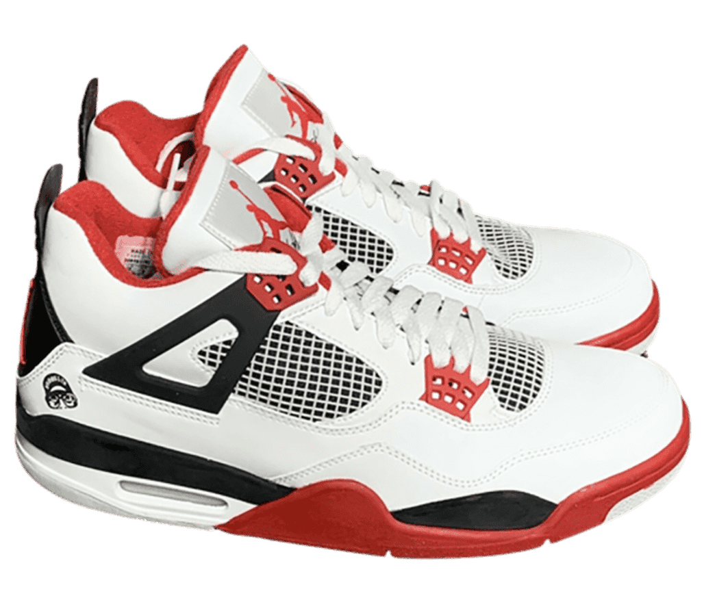 A white pair of AJ4 “Fire Red” sneakers with red lace cages, lining, and outsoles and black midsoles and heels.