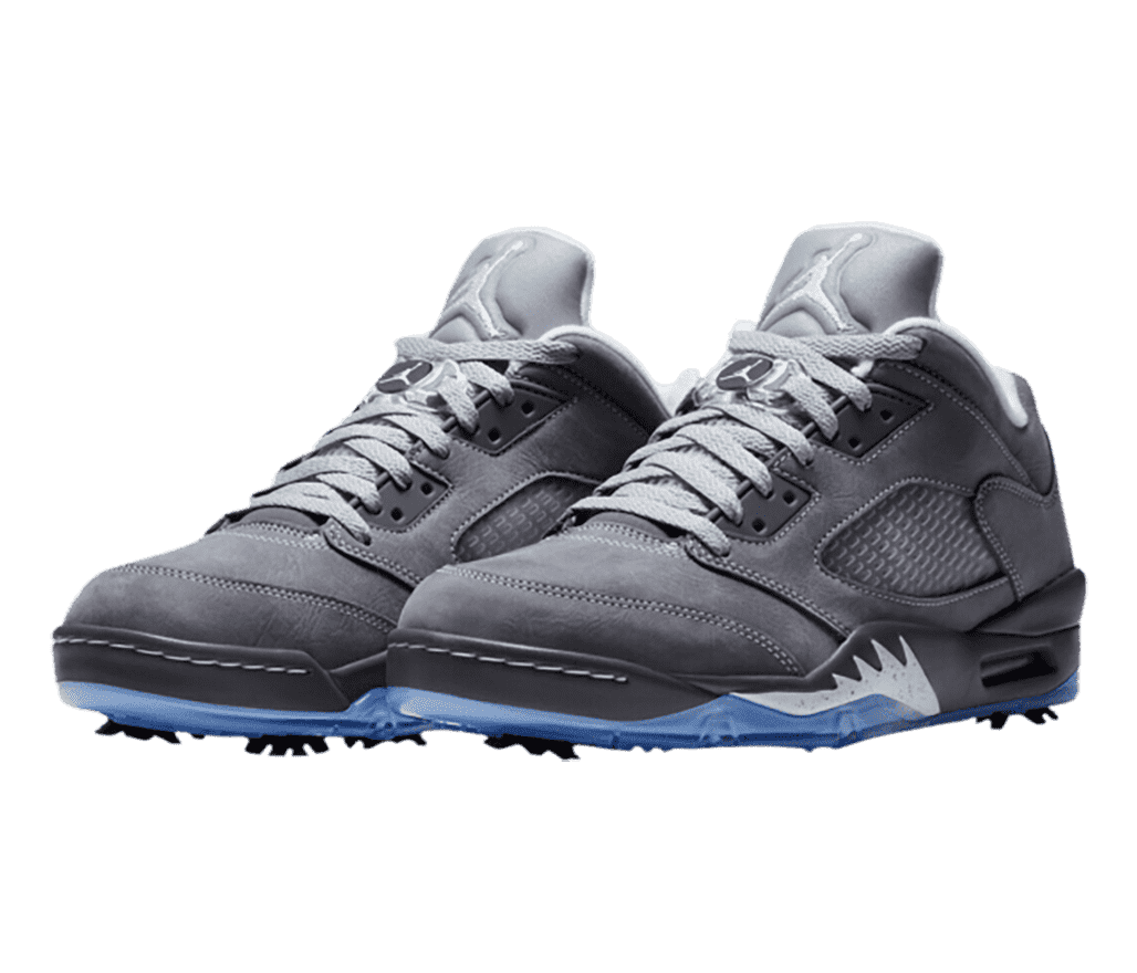 A gray suede pair of AJ5 sneakers with blue translucent outsoles and golf cleats.