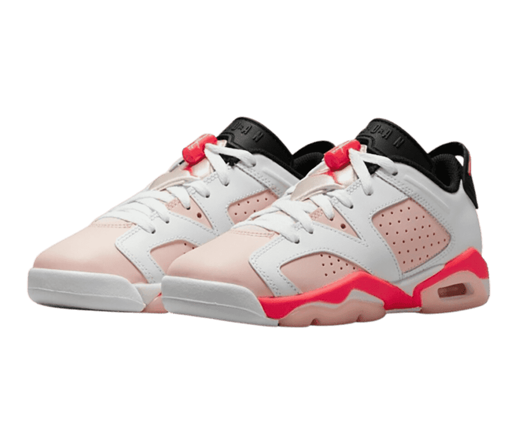 A light pink pair of AJ6 Low “Atmosphere” sneakers with white overlays, black tongues and lining, and hot pink accents.