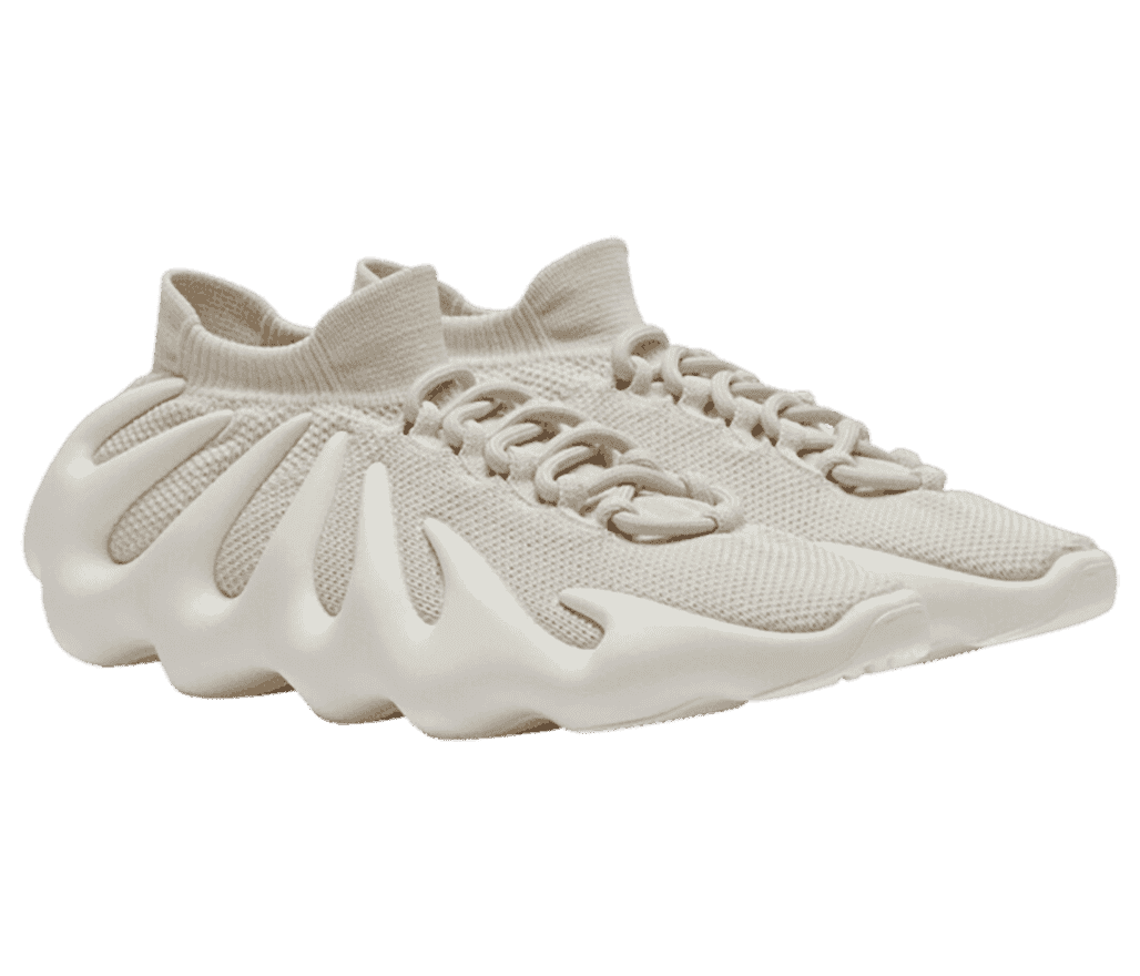 A pair of 'YEEZY 450 White Cloud' sneakers with a
                      jagged white boosted sole, and white semi-translucent side.