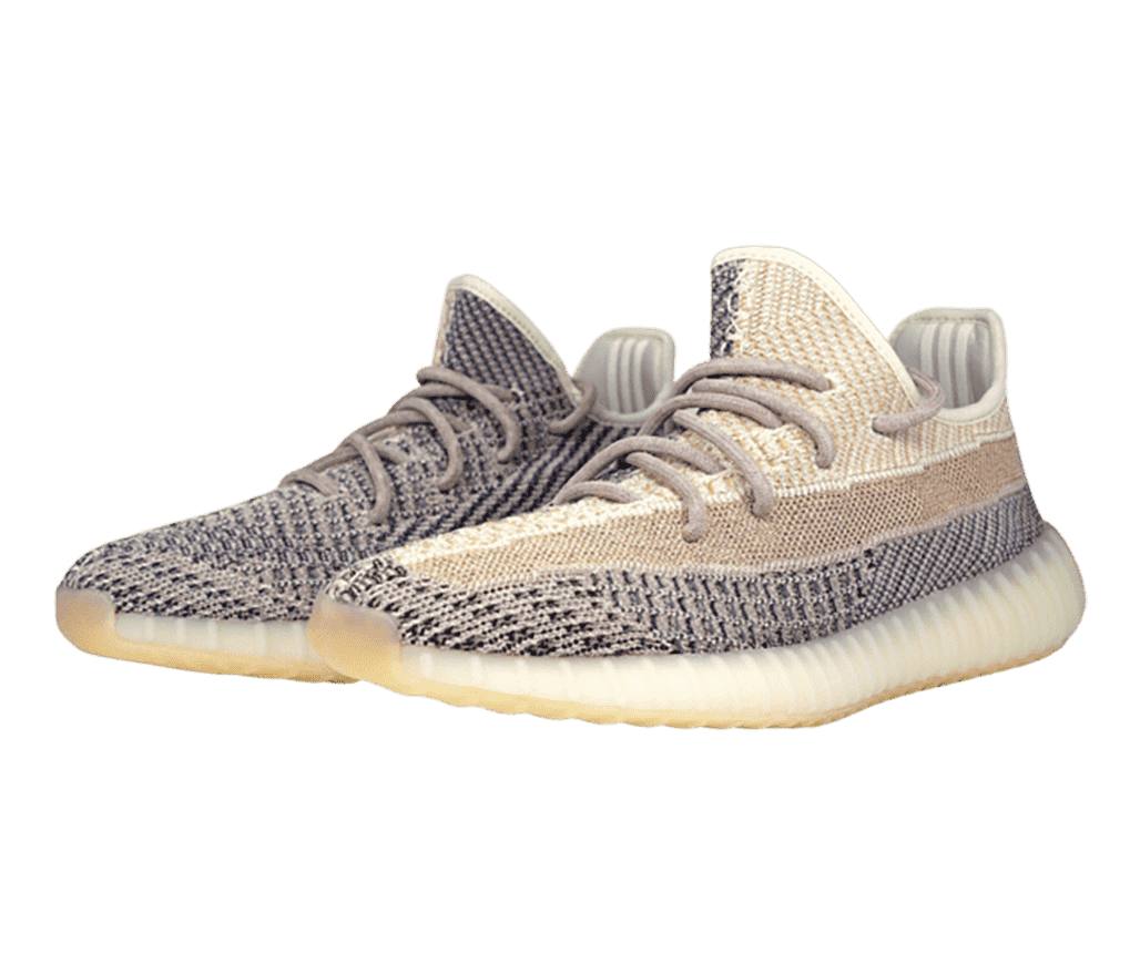A pair of 'YEEZY Boost 350 V2 Ash Pearl' sneakers
                      with a beige, tan, and gray cotton canvas and a semi-translucent sole.