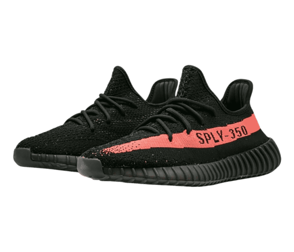 A pair of 'YEEZY Boost 350 V2 Black Red' sneakers in
                      black and a red side stripe with ”SPLY-350,” printed on it.