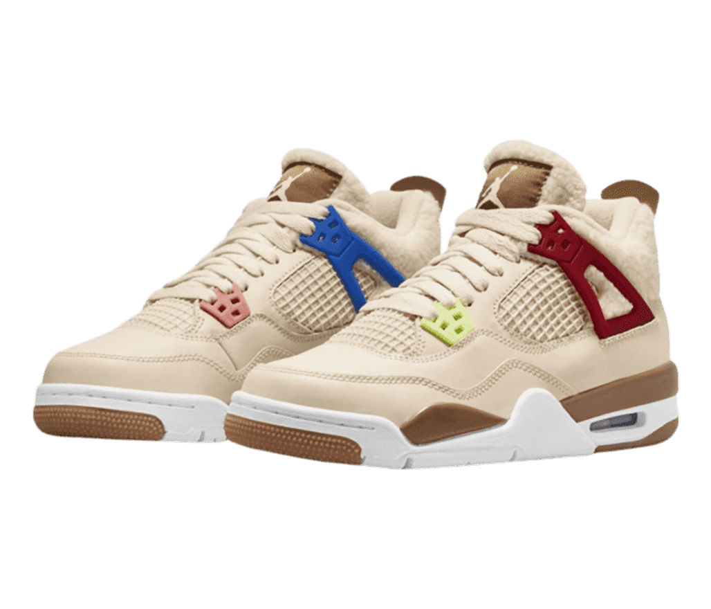 A tan pair of AJ4 sneakers with brown details, blue, red, and light green lace cages, and wool collars and tongues.