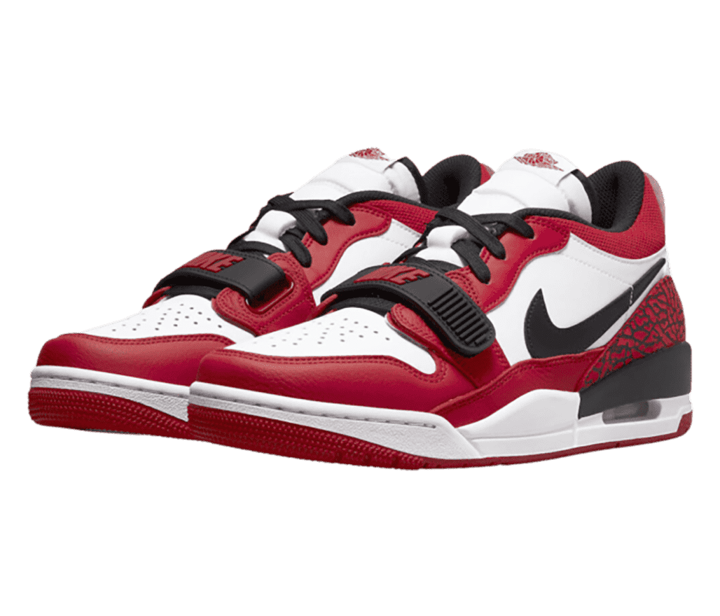 A pair of Jordan Legacy 312 Low “Chicago Red” sneakers with elephant print heels and rubber lace straps.