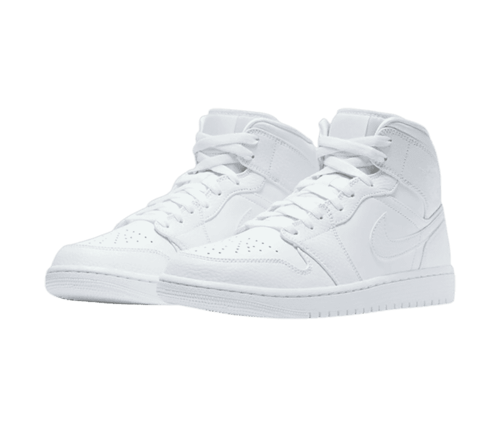 An all-white pair of AJ1 Mid sneakers with tumbled leather overlays.