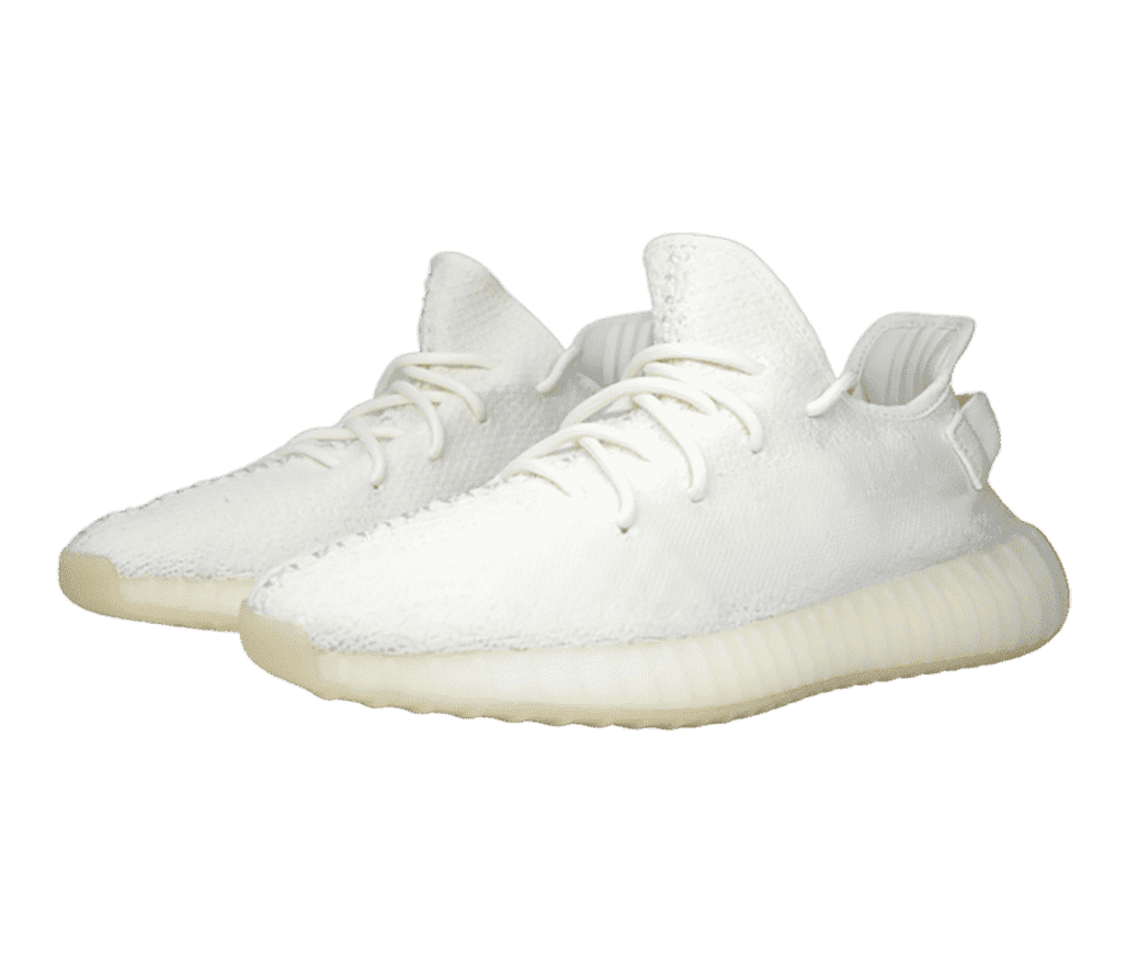 A pair of Adidas Yeezy Boost 350 V2 “Cream” sneakers with white uppers and off-white soles.