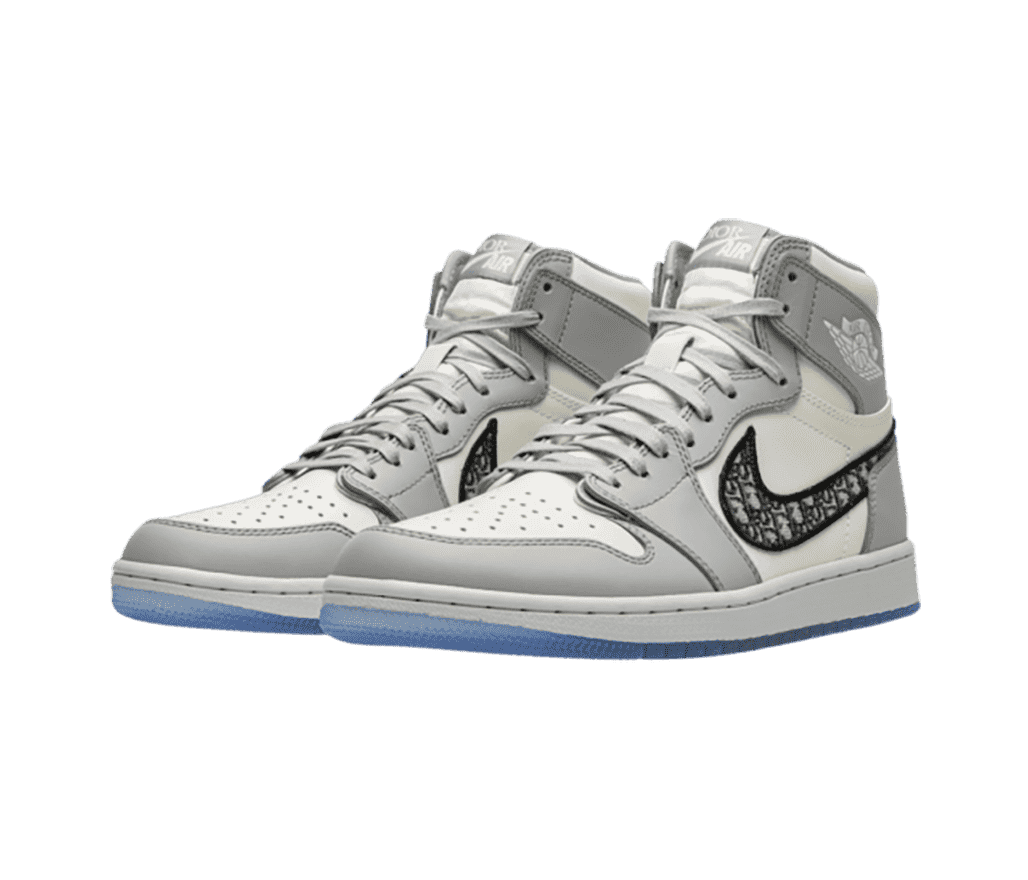 An off-white and gray pair of Dior x AJ1 High sneakers with embroidered Dior markings on the Swooshes and blue outsoles.