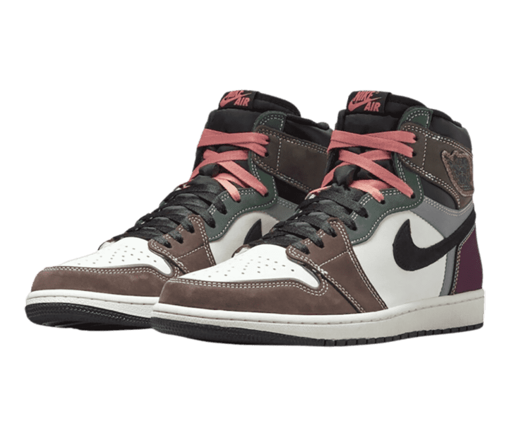 A pair of AJ1 High “Hand Crafted” sneakers with brown, green, and purple overlays in suede and leather.