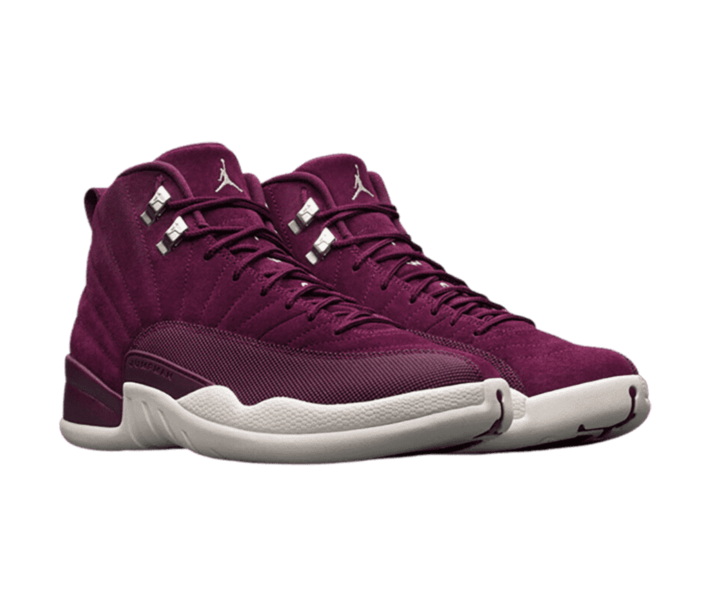 A pair of maroon suede AJ12 sneakers with light gray soles.