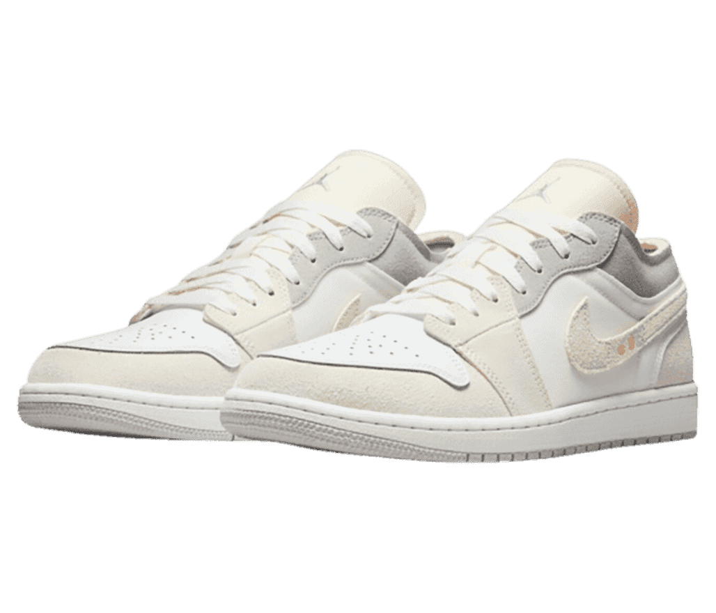 A pair of AJ1 Low “Inside Out” sneakers in white uppers, off-white suede overlays, and gray collars.
