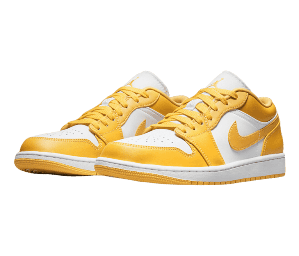 A pair of AJ1 Low sneakers in white uppers with vibrant yellow overlays.