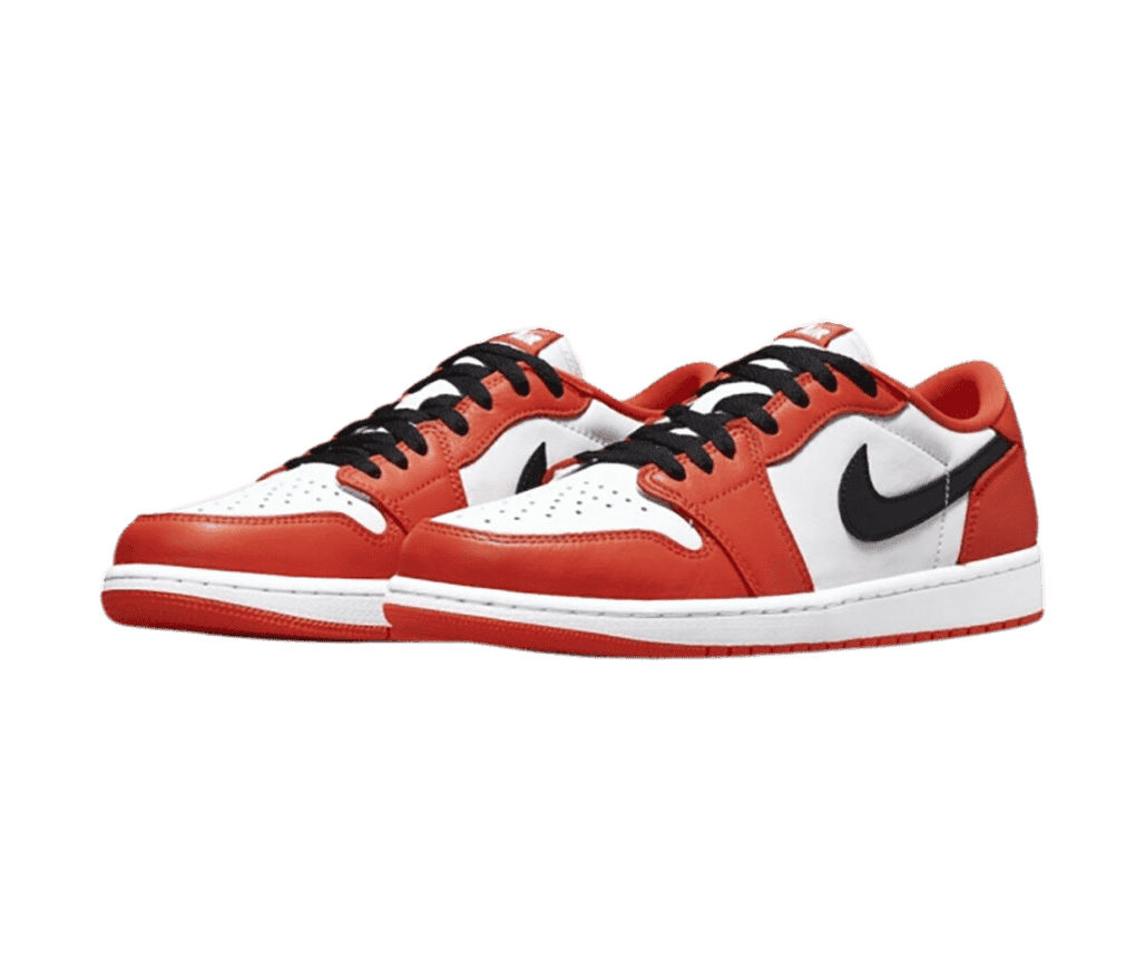 A pair of AJ1 Low sneakers in white and poppy red uppers with black laces and Swooshes..