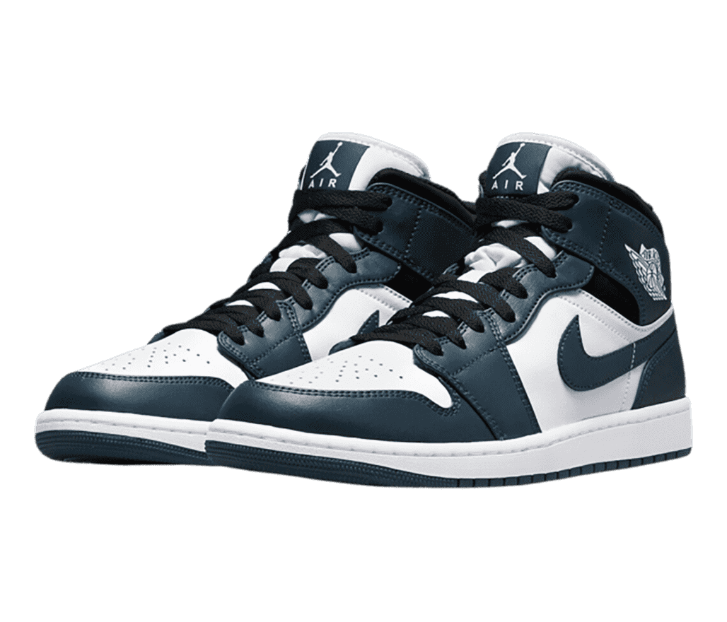 A white pair of AJ1 Mid sneakers with navy overlays and black laces and collars.