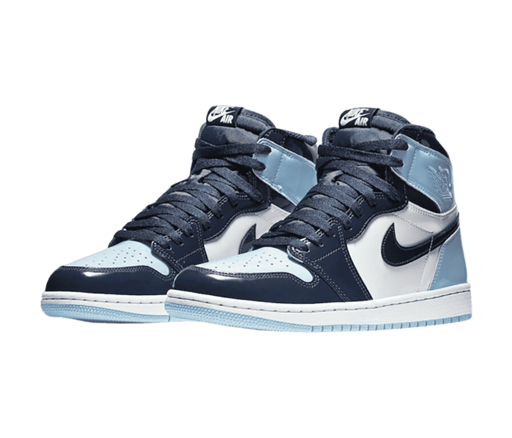 A pair of AJ1 High “Obsidian” sneakers in white leather uppers with navy tips, vamps, and collars and light blue heels.