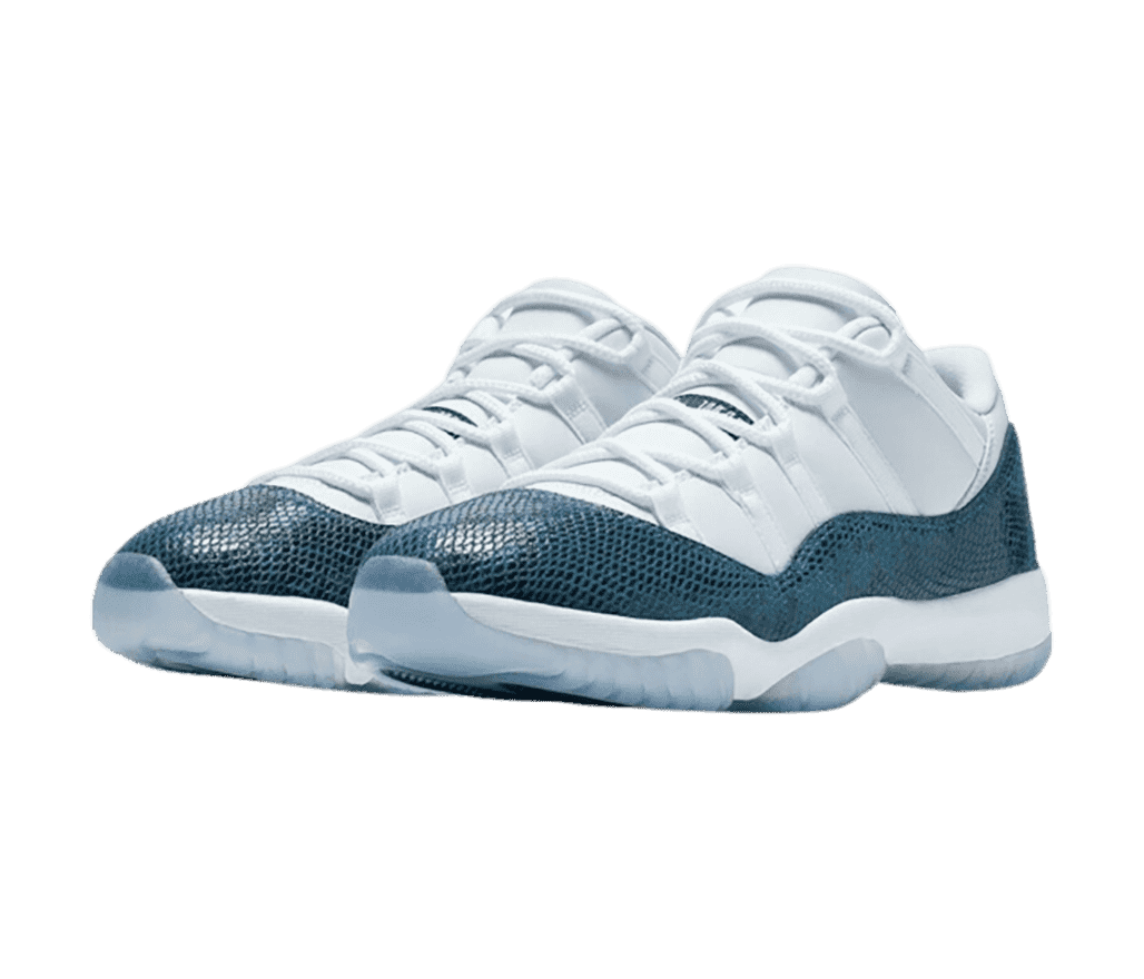 A white pair of AJ11 sneakers with dark teal snakeskin mudguards and light blue translucent outsoles.