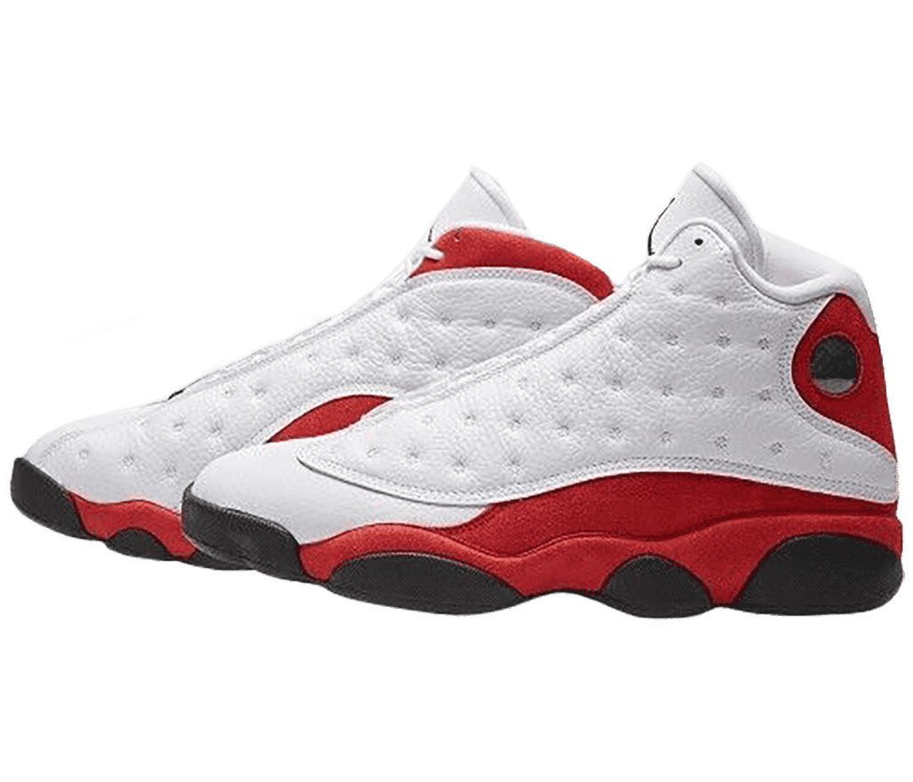 The side-view of a white pair of AJ13 sneakers with red suede quarters and collars and dark gray outsoles.