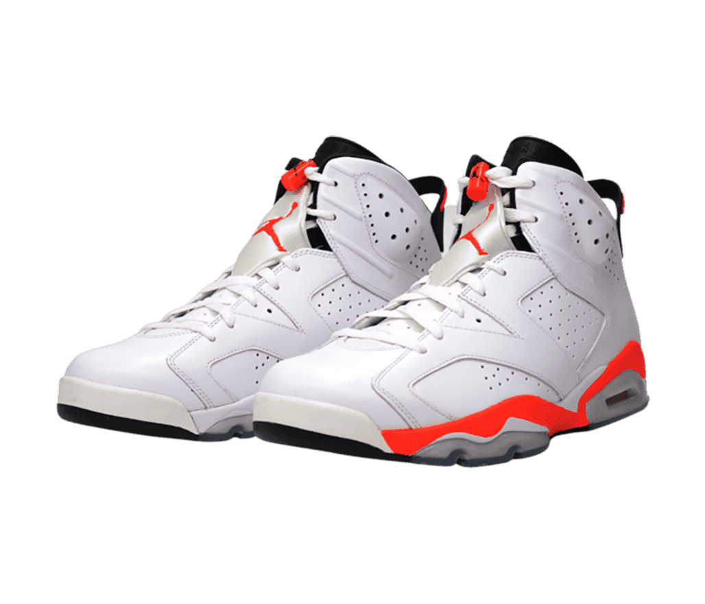 An all-white pair of AJ6 sneakers with black tongues and bright orange details.