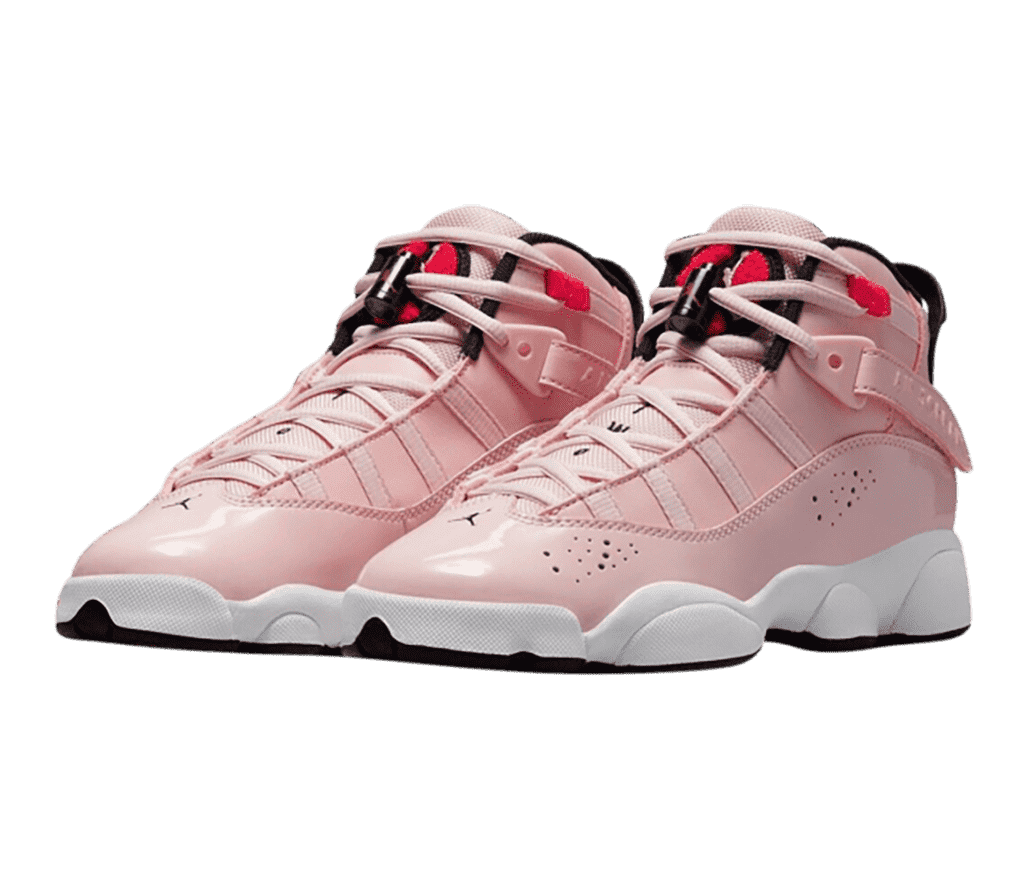 A pink patent leather pair of Jordan 6 Rings “Atmosphere” sneakers with light pink laces, white midsoles, and black lining.