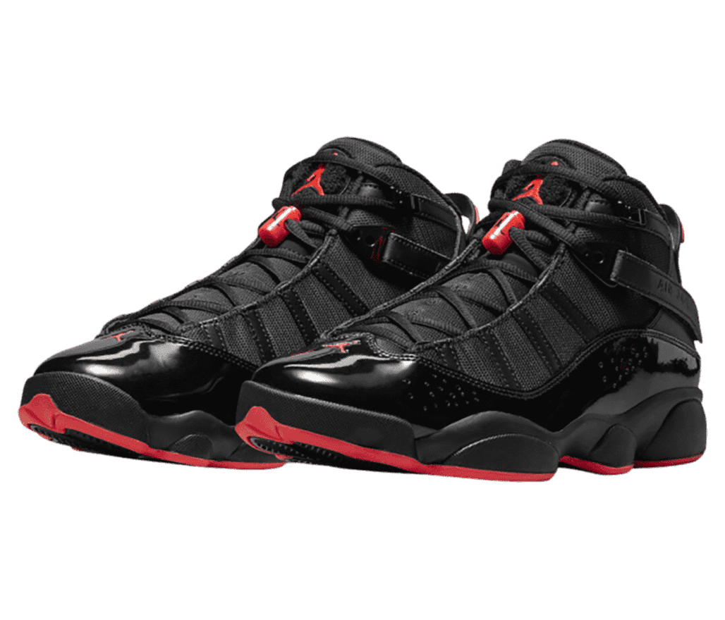 A black pair of Jordan 6 Rings sneakers with red outsoles and lace locks.