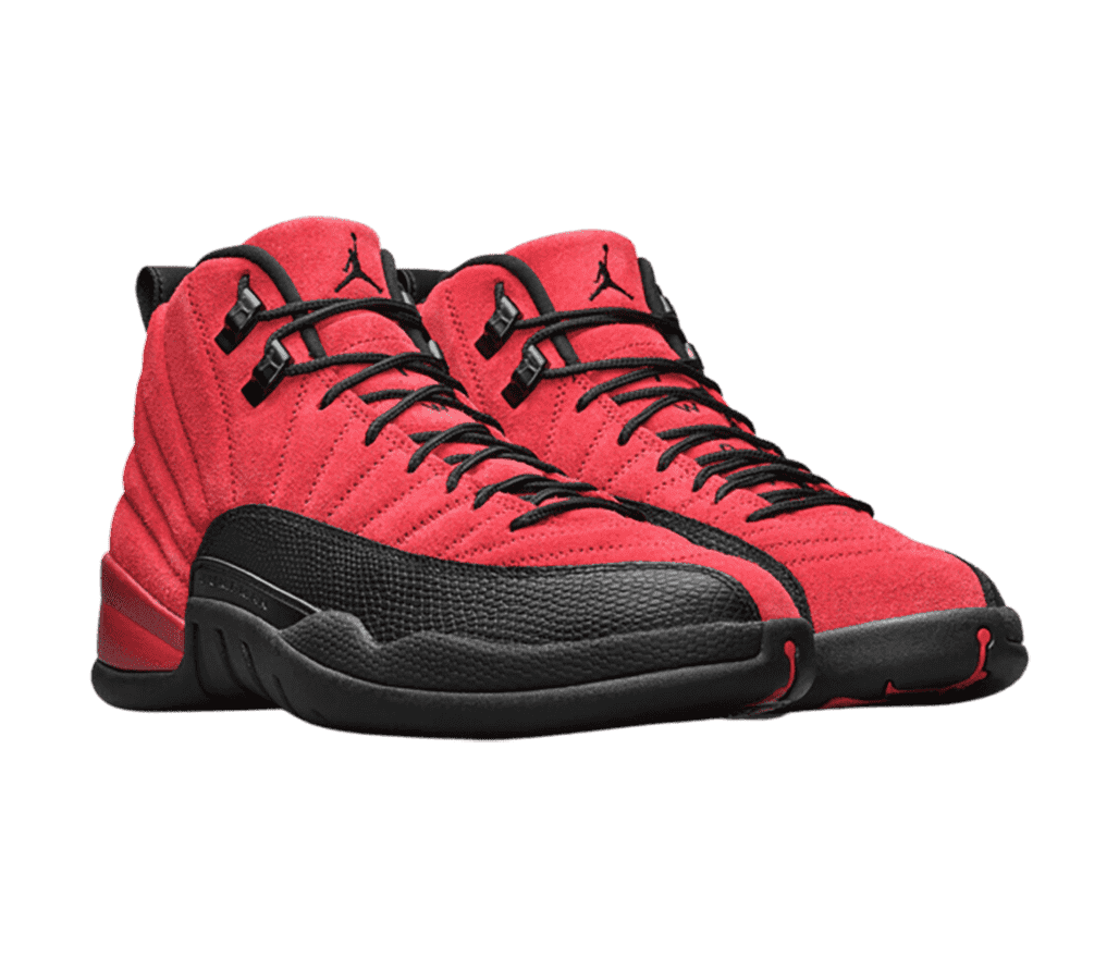 A red suede pair of AJ12 sneakers with black soles and mudguards.