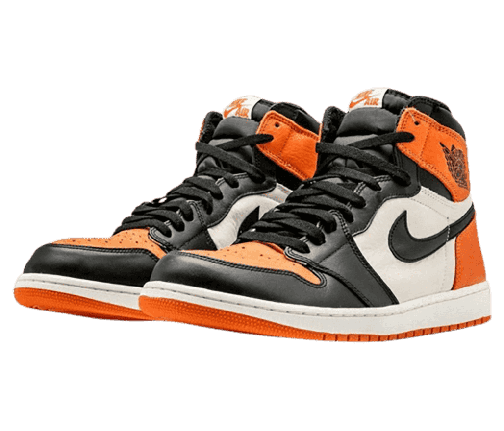 A black and white pair of AJ1 High sneakers with orange toeboxes, collar straps, heels, and outsoles.