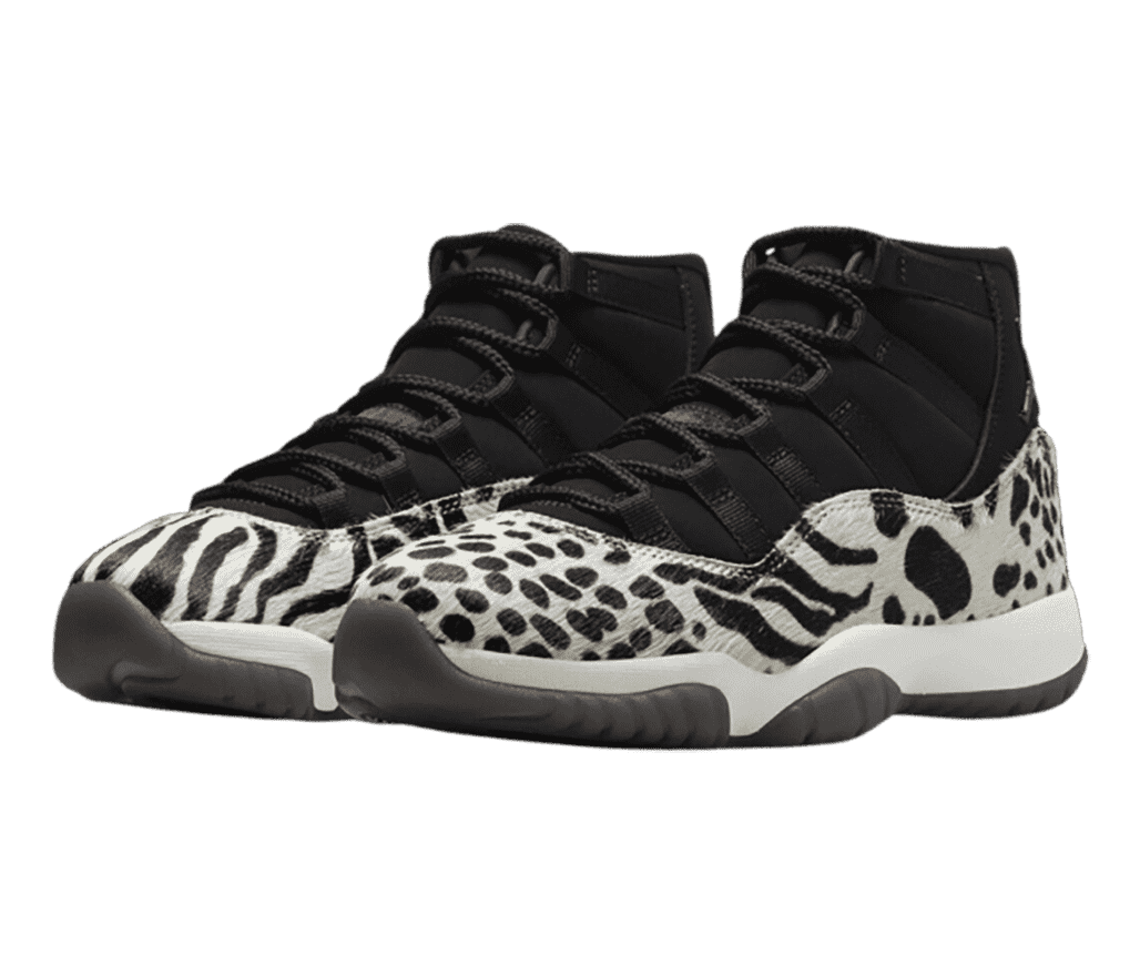 A pair of AJ11 “Animal Instinct” sneakers with black uppers and zebra print pony hair overlays.