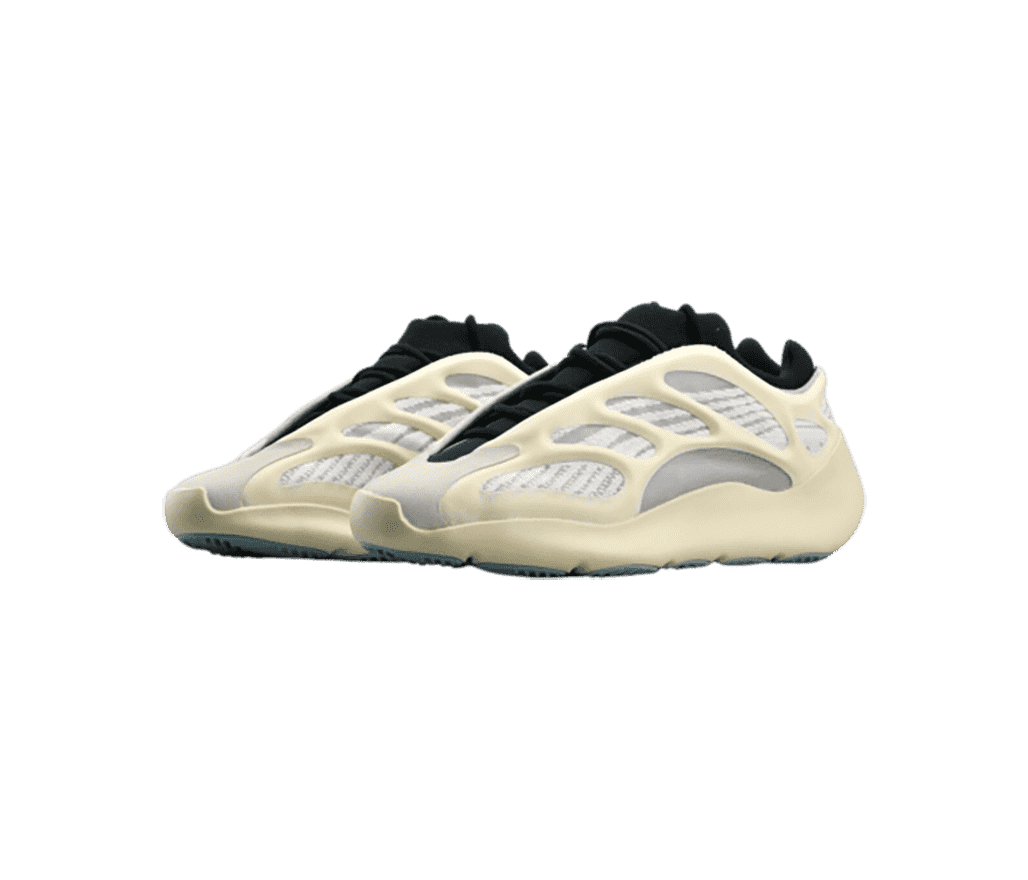 A pair of Yeezy 700 “Azael” sneakers with black tongues and laces, white mesh uppers, and off-white rubber cages.