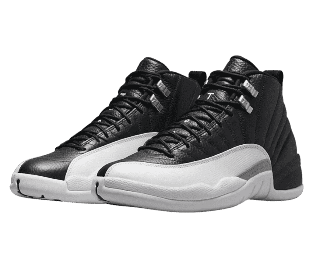A black pair of AJ12 sneakers with white mudguards and chrome lace locks.