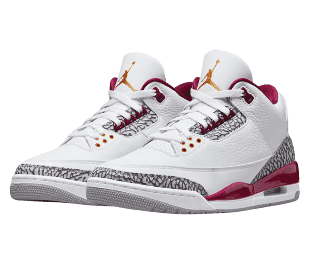 A white pair of AJ3 sneakers with elephant print detailing and maroon accents.