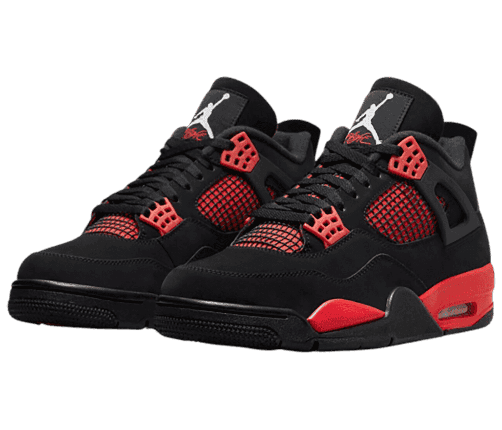 A black suede pair of AJ4 sneakers with red detailing.