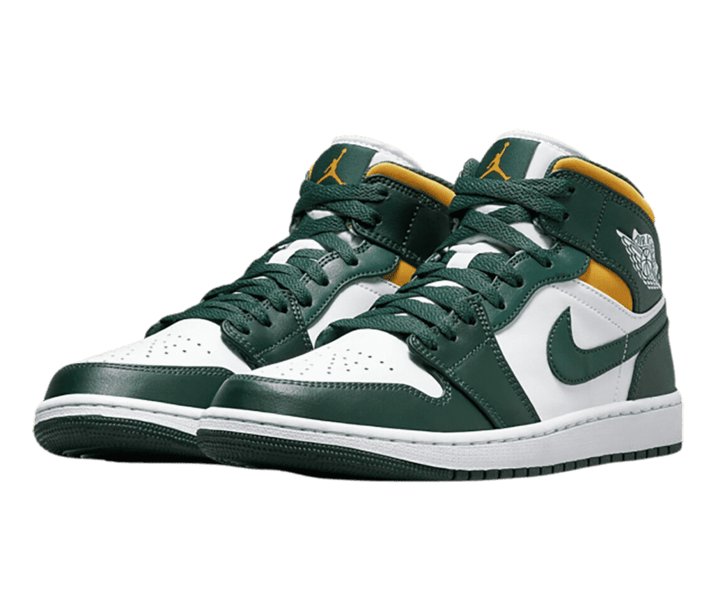 A white pair of AJ1 Mid sneakers with green overlays and gold collars and Jumpman logos on the tongues.