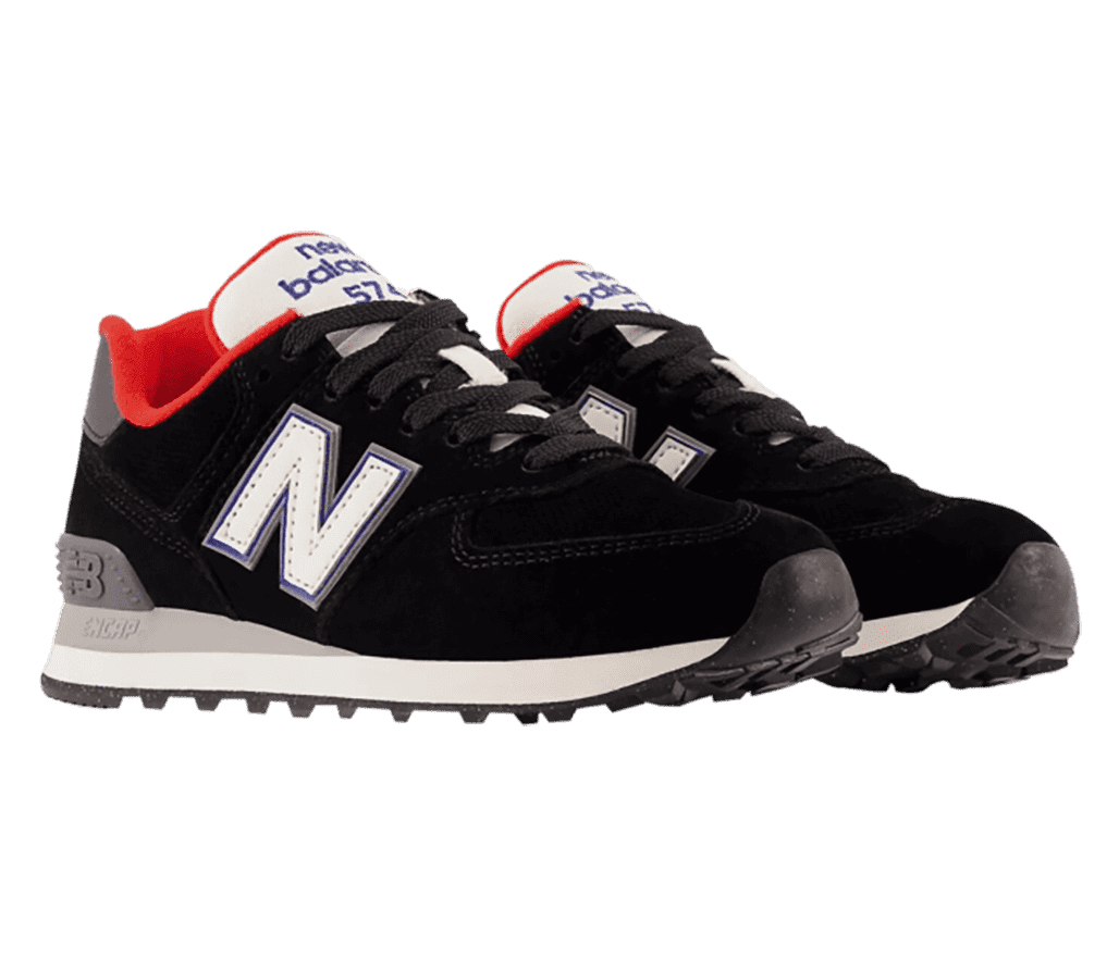 A pair of New Balance sneakers that is primarily black with accents of white for the logos, and red, grey, and purple.