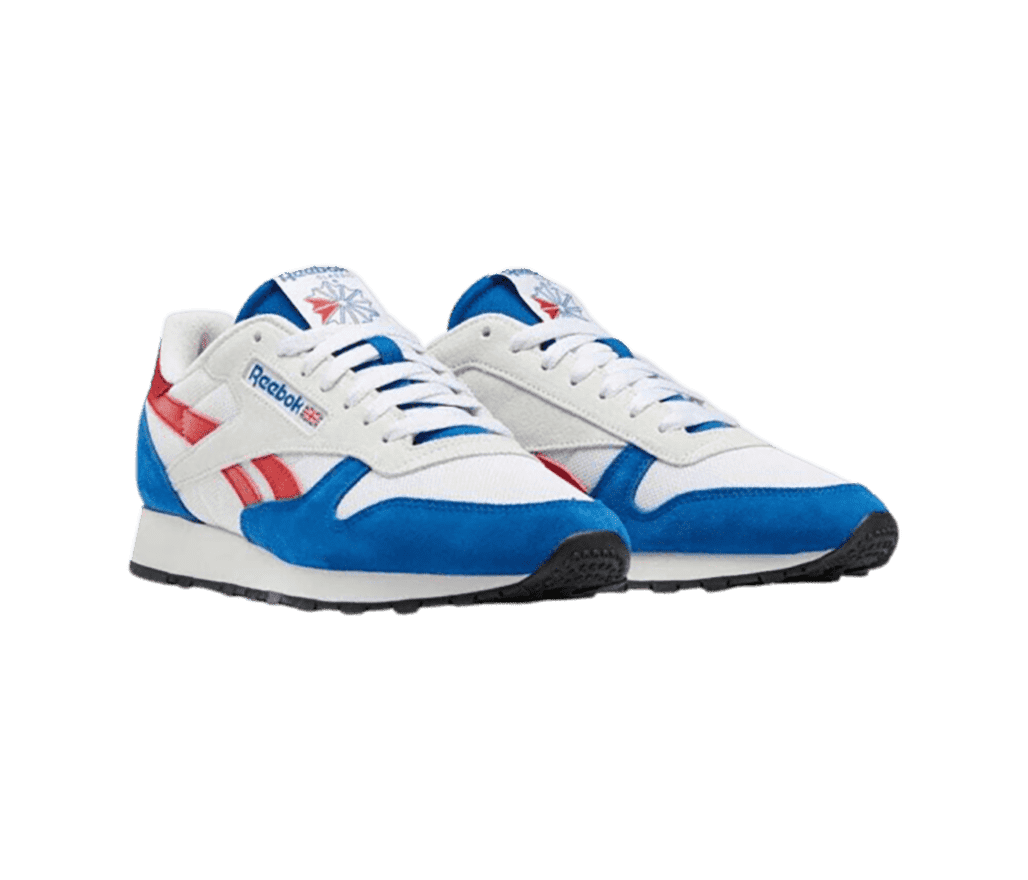 A pair of Reebok shoes in white with a blue toe cap, counter, and tongue. There are small red accents on the logo and tongue.