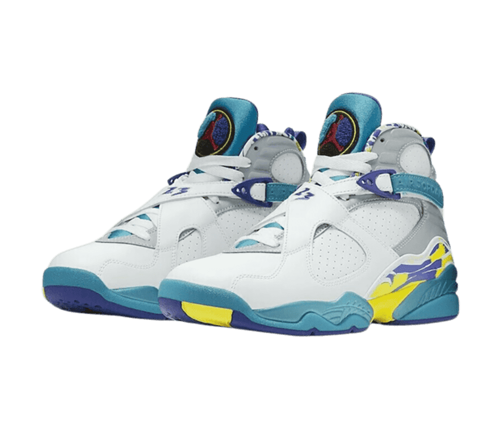 A white pair of AJ8 “Aqua” sneakers with teal tongues, midsoles, and lace straps and blue and yellow abstract details.