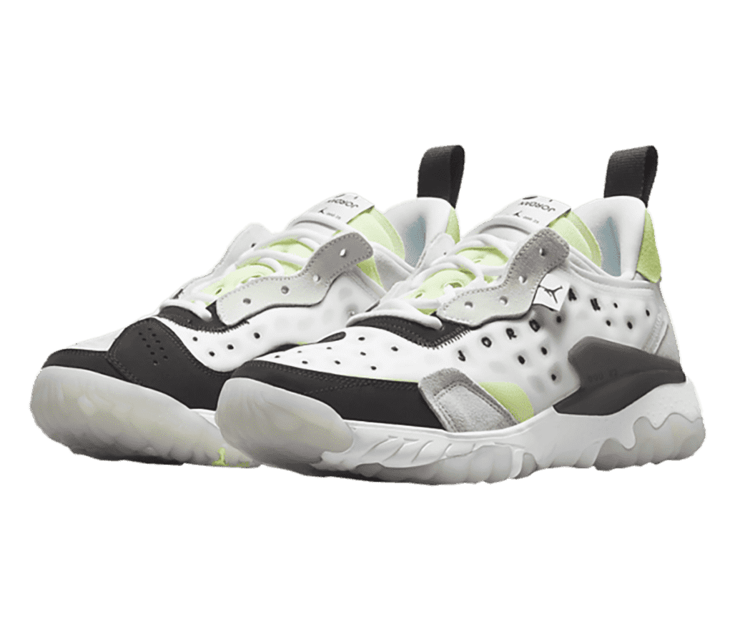 A white pair of Jordan Delta 2 sneakers in suede and perforated rubber uppers with black detailing and light green accents.