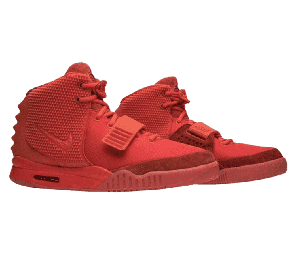A pair of Air Yeezy 2 “Red October” sneakers in all-red canvas and rubber, a lace strap, a lace lock, and ribbed heels.