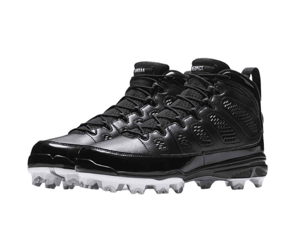 A black pair of AJ9 “RE2PECT” sneakers with patent leather overlays and white and gray baseball cleats.