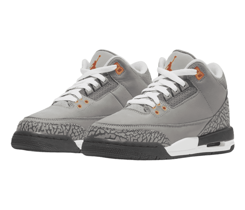 A gray suede pair of AJ3 sneakers with elephant print heels and tips, dark gray outsoles, white laces, and orange eyelets.
