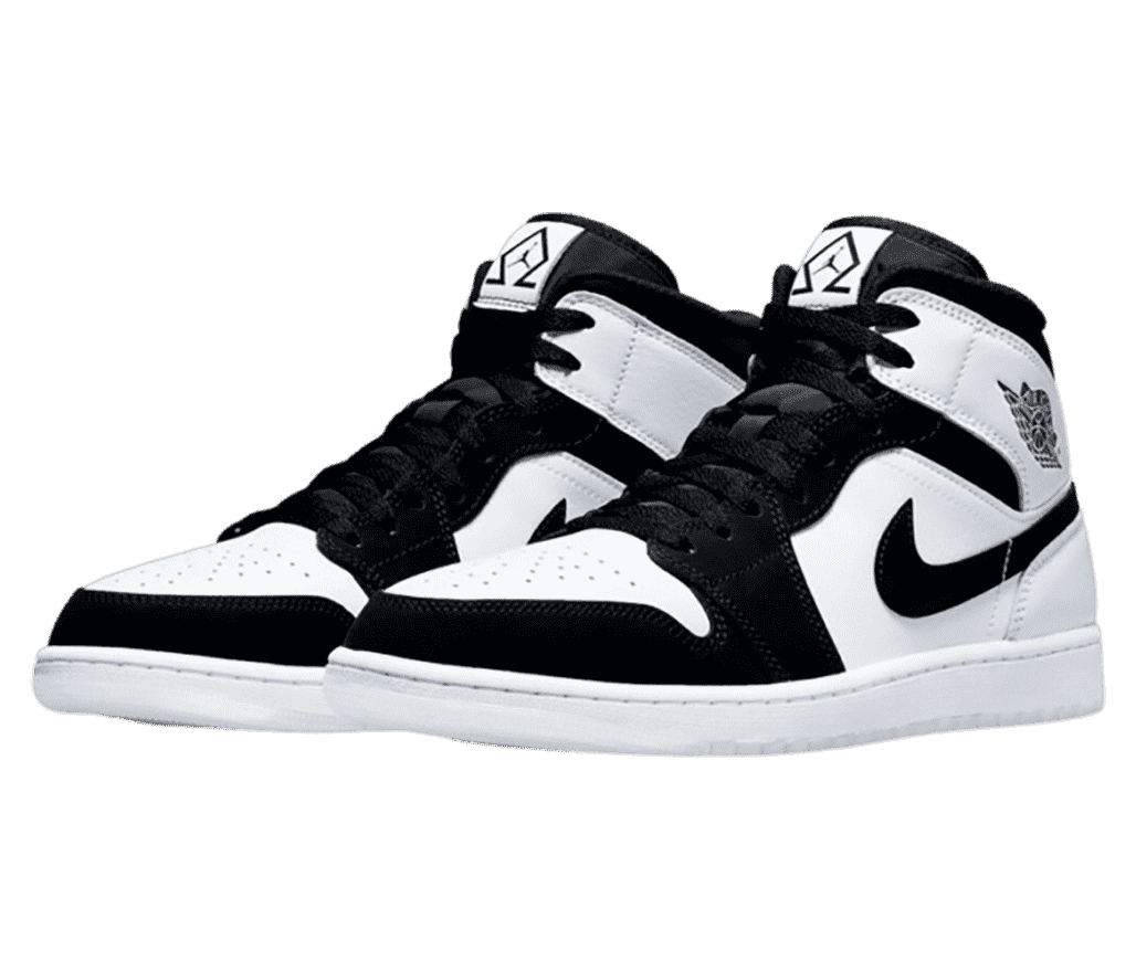 A pair of AJ1 Mid “Diamond” sneakers in white with black suede tips, vamps, collars, and Swooshes.