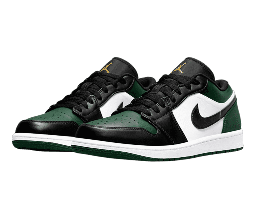 A pair of AJ1 Low sneakers in black, white, and green uppers with gold Jumpman logos on the tongues.