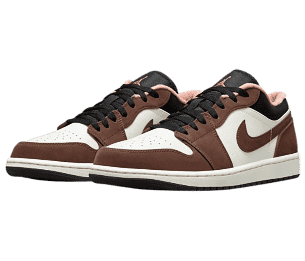 A brown and white suede pair of AJ1 Low sneakers with black collars and laces and pink fleece lining.