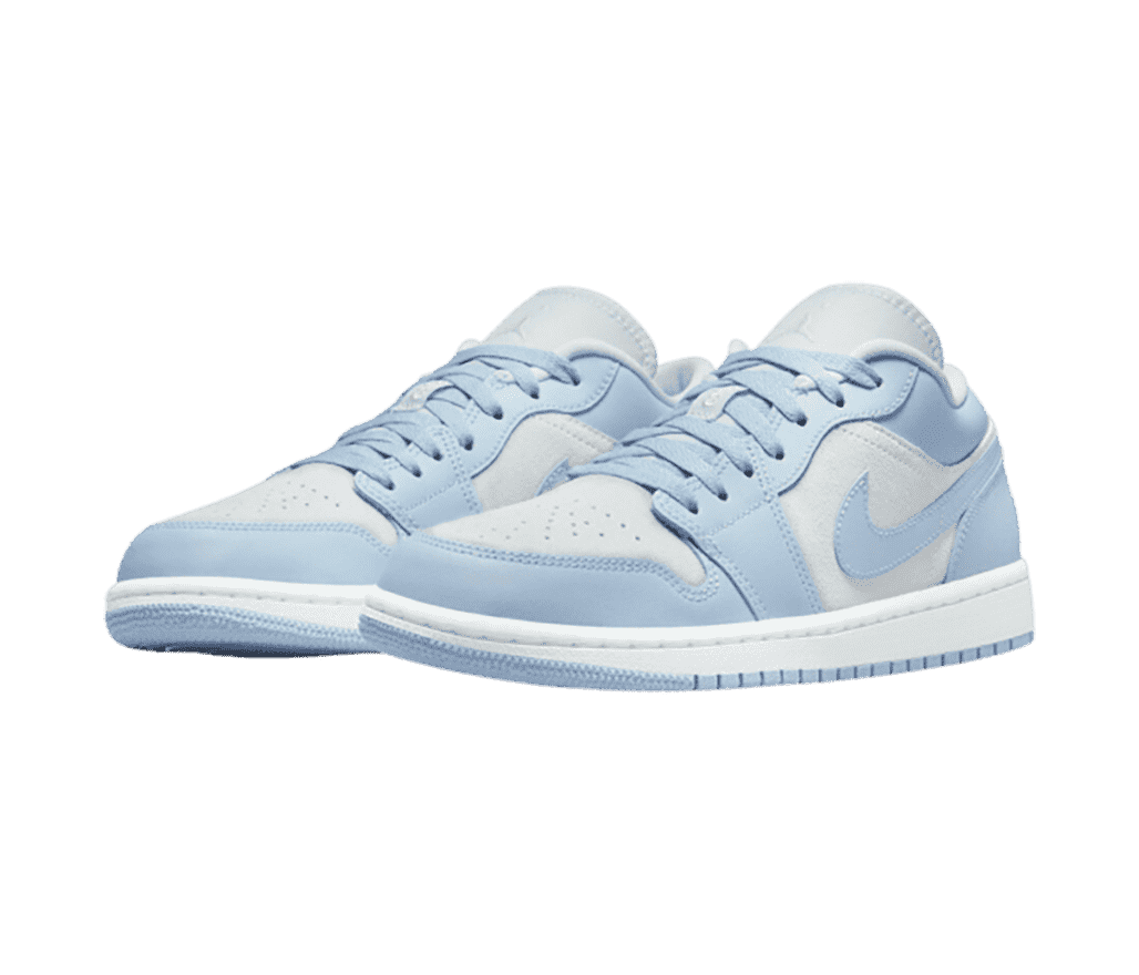 A suede pair of AJ1 Low sneakers in light gray and light blue uppers.