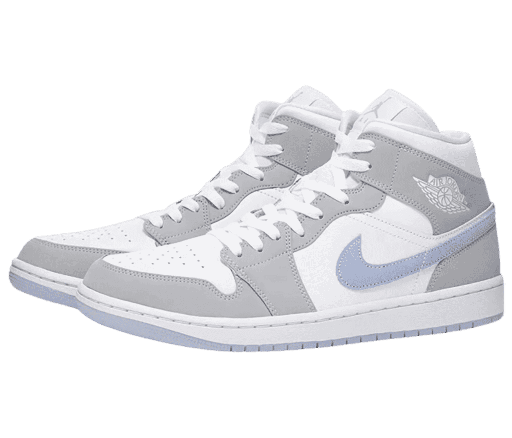 A white suede pair of AJ1 Mid sneakers with gray overlays and light blue Swooshes and outsoles.