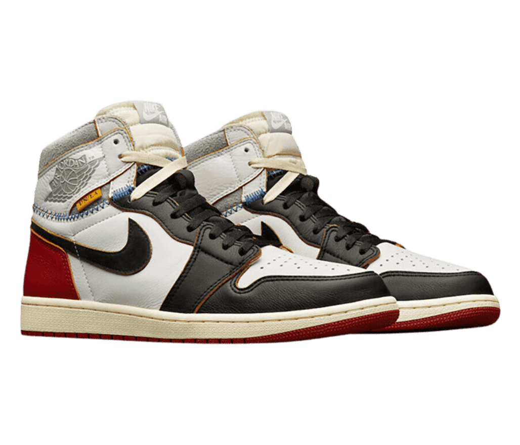 A pair of Union x AJ1 High sneakers in white, black, and red uppers, cream tongues, and gray suede collars.
