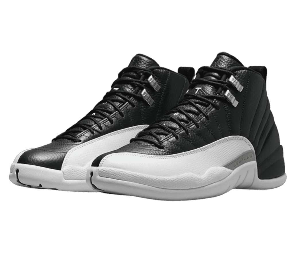 A black pair of AJ12 sneakers with white mudguards and gray accents.