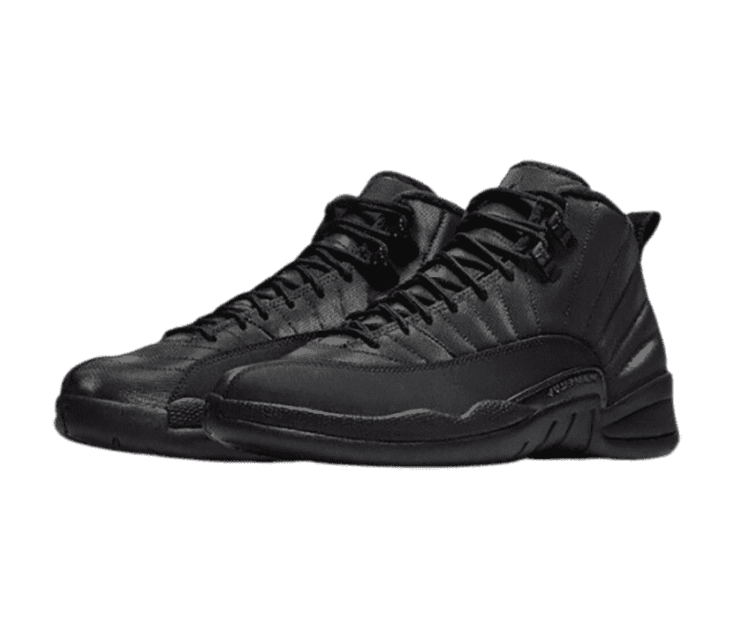 An all-black pair of AJ12 sneakers with suede mudguards.