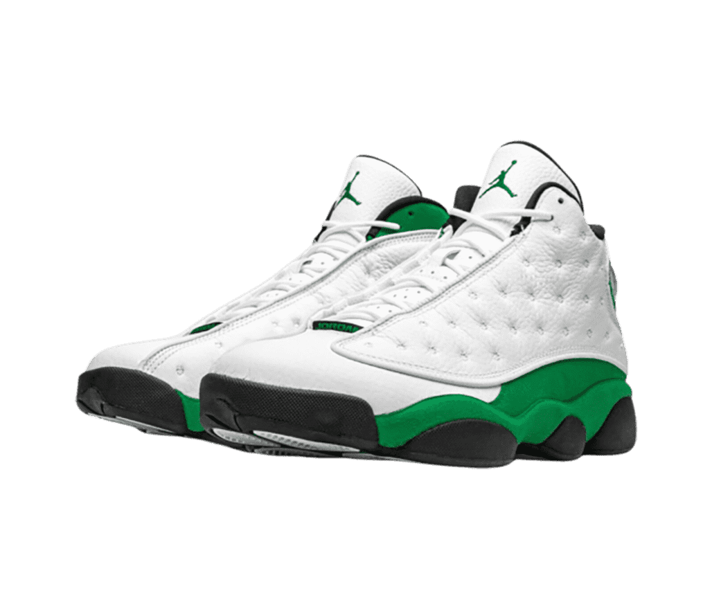 A white pair of AJ13 sneakers with green suede quarters, collars, and midsoles.